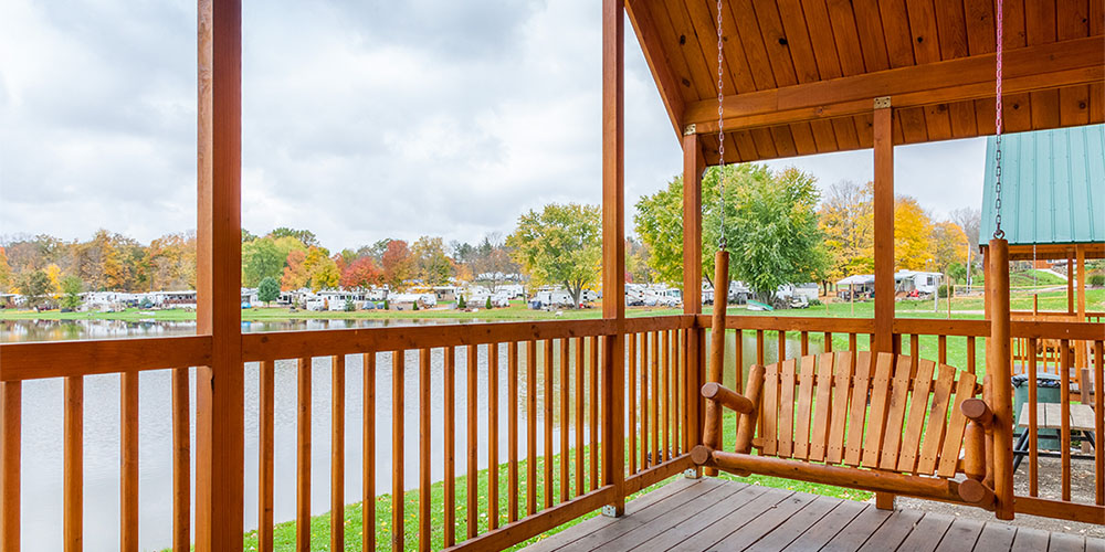 Enjoy your Ohio glamping trip with a porch swing in our Deluxe Lakeside Lodges.