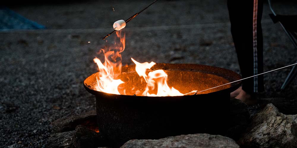 Cold weather camping is perfect to snuggle up by the campfire!