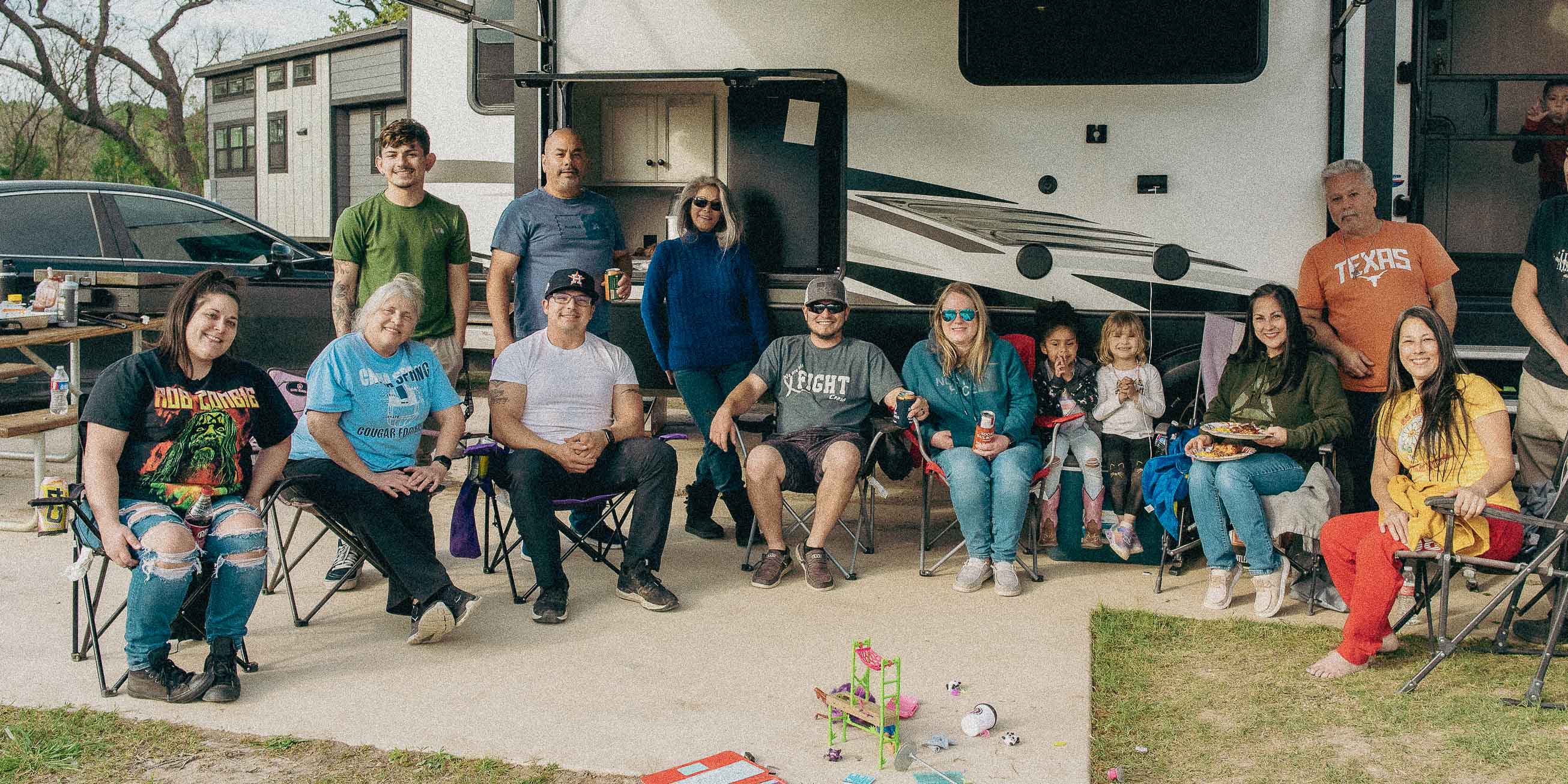 A large group of campers hanging out at their campsite at Camp Fimfo Waco