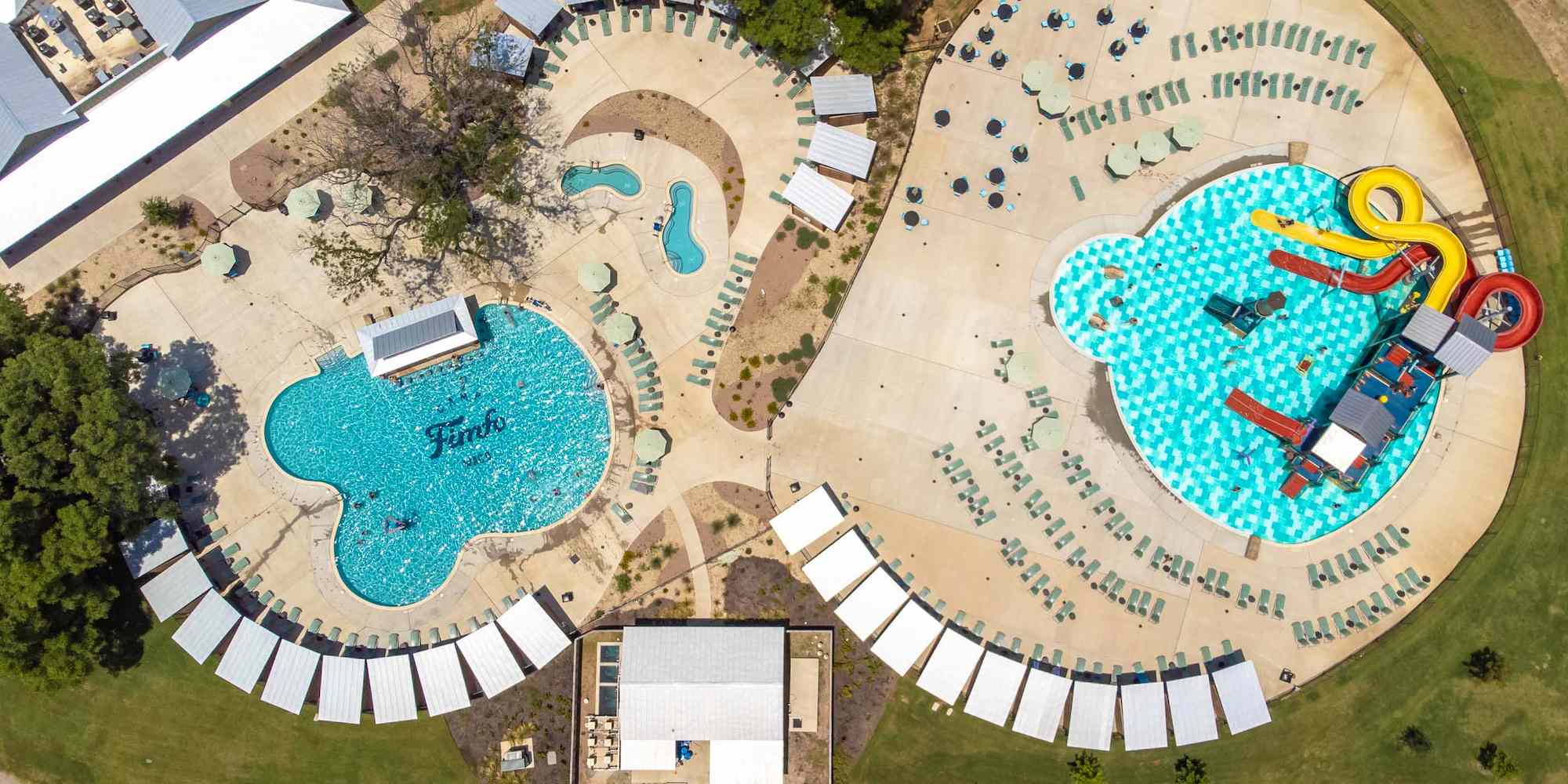 A drone shot of the water park and pool at Camp Fimfo Waco