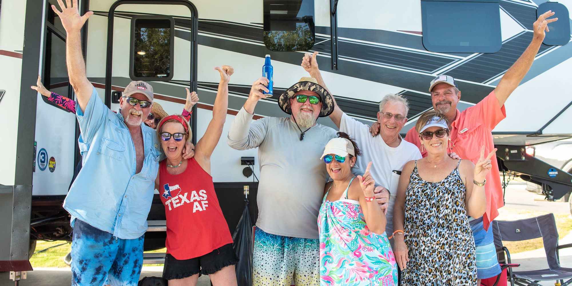 A group of guests having a blast at their RV site at Camp Fimfo