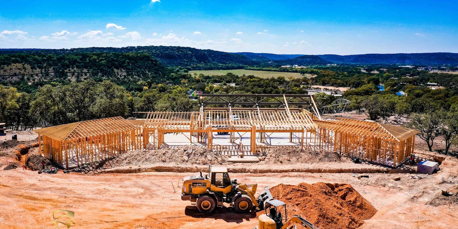 An aerial view of the construction of Willow Ridge, the new event center located within Camp Fimfo Texas Hill Country 