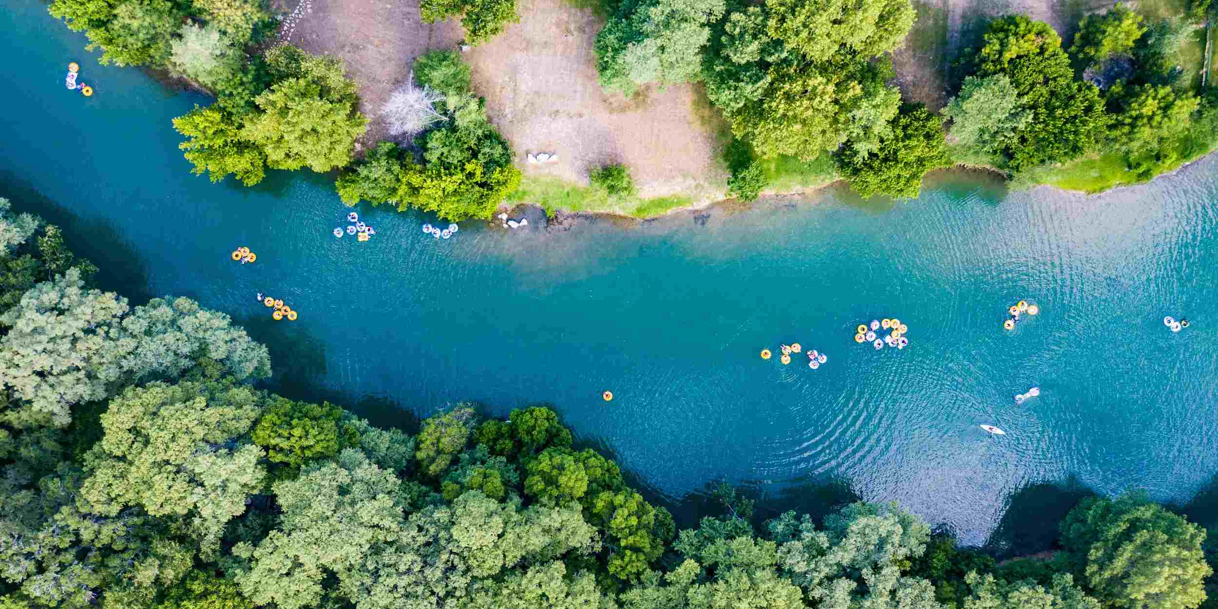 An aerial view of tubers on the Guadalupe River in New Braunfels, Texas
