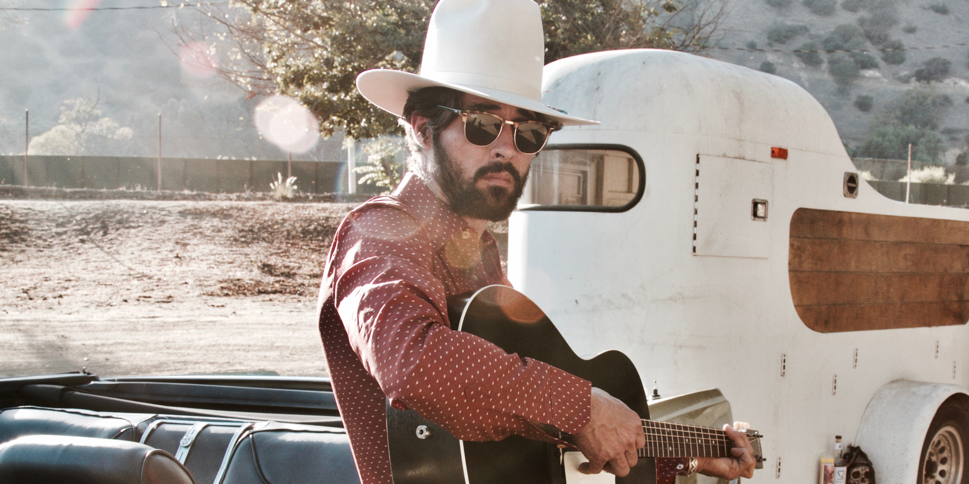 Ryan Bingham playing his guitar