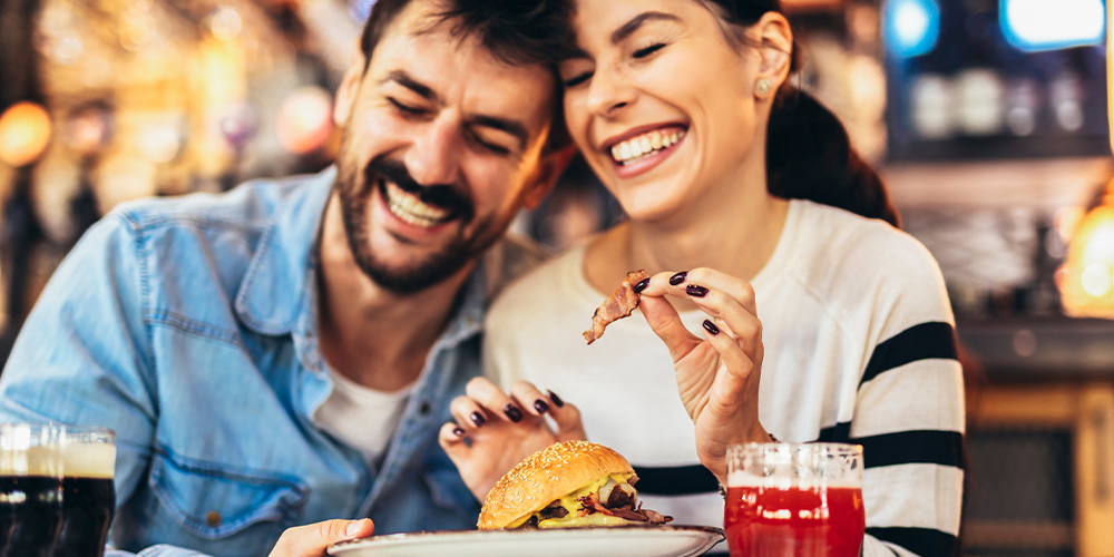 Couple celebrating a romantic dinner at Taste of Dallas - a great thing to do in Dallas!