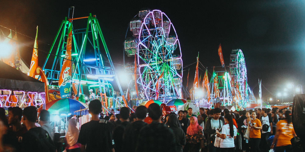 Crowd gathering in line for carnival rides during the Sandwich Fair.