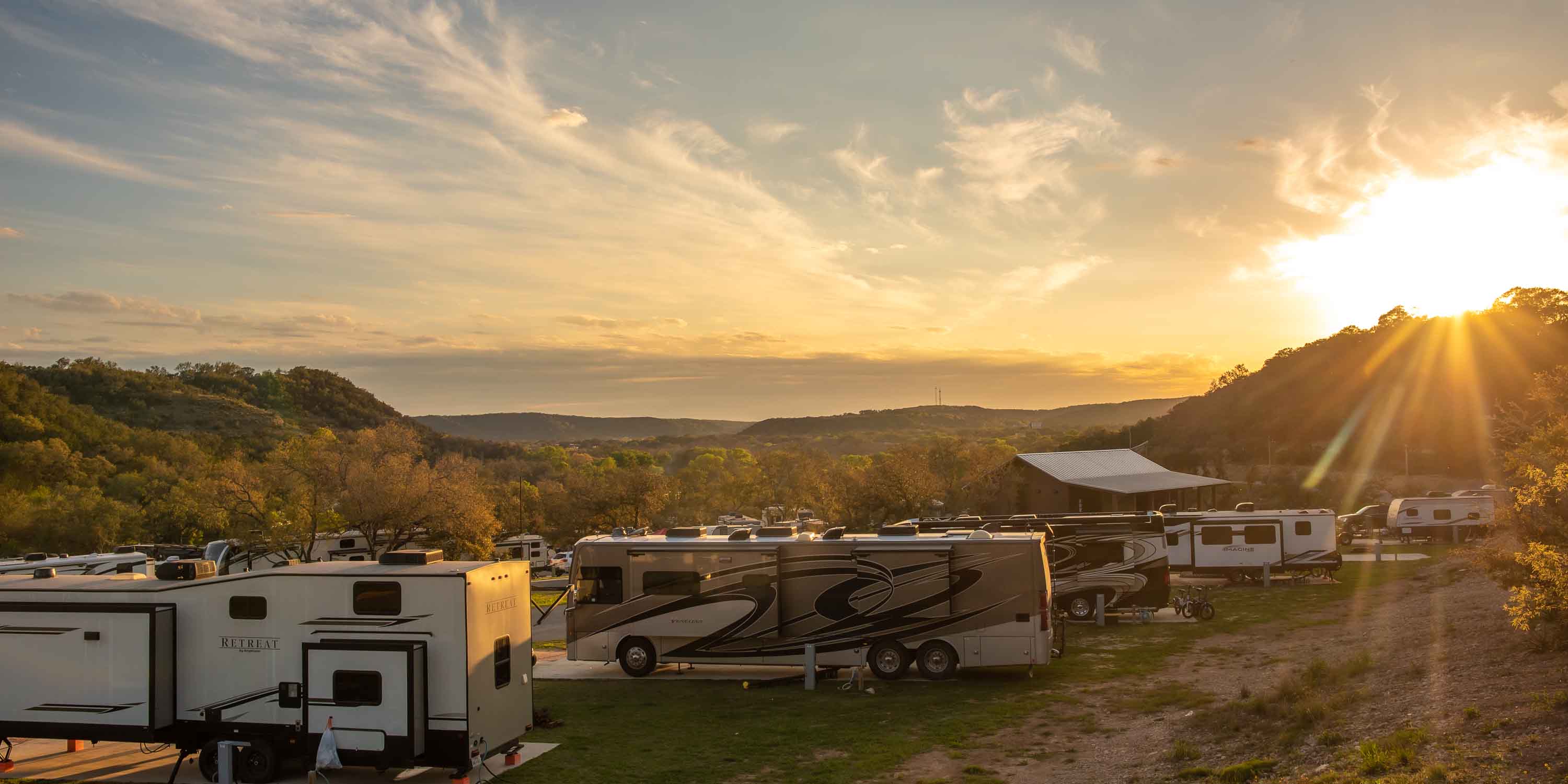An aerial view of the RV sites and the beautiful scenery at Camp Fimfo Texas Hill Country