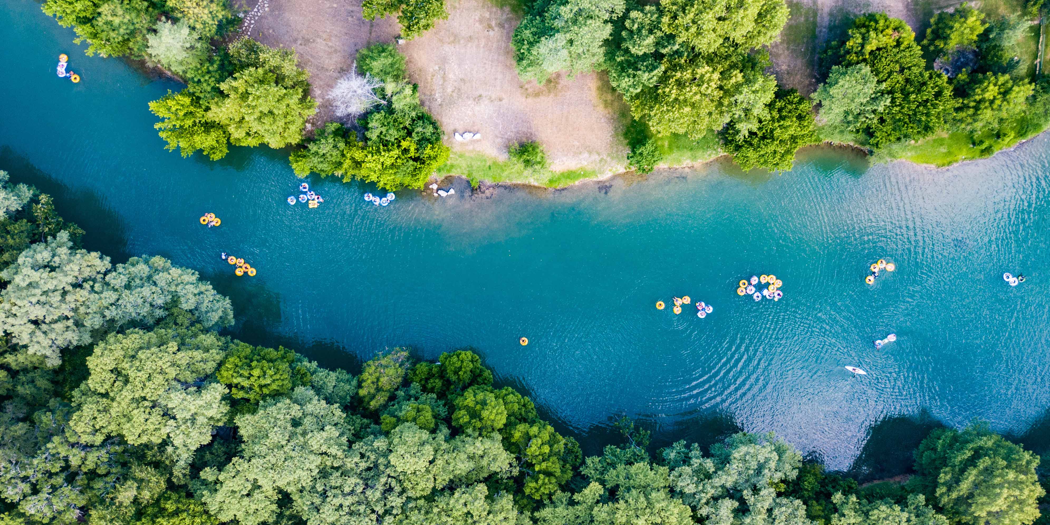 Tubers floating down the Guadalupe River in New Braunfels, TX