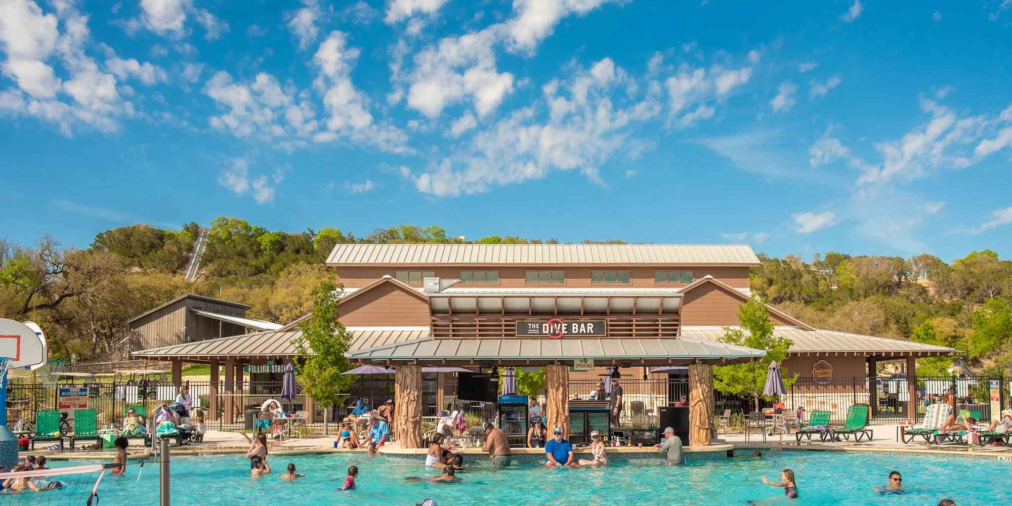 The pool and swim-up bar at Camp Fimfo Texas Hill Country