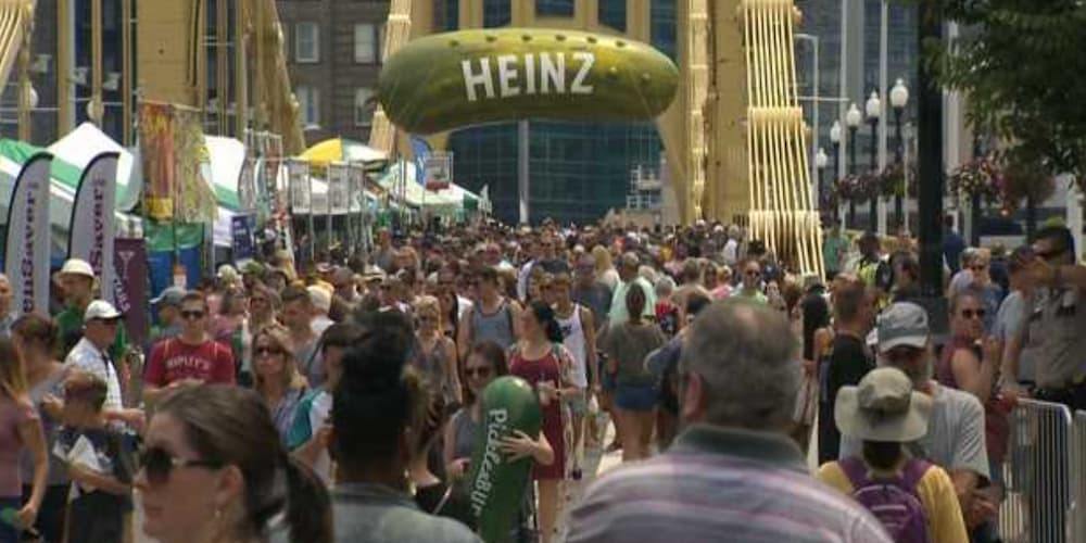 People enjoying a festival in downtown Pittsburgh, PA, exciting events in downtown Pittsburgh, PA