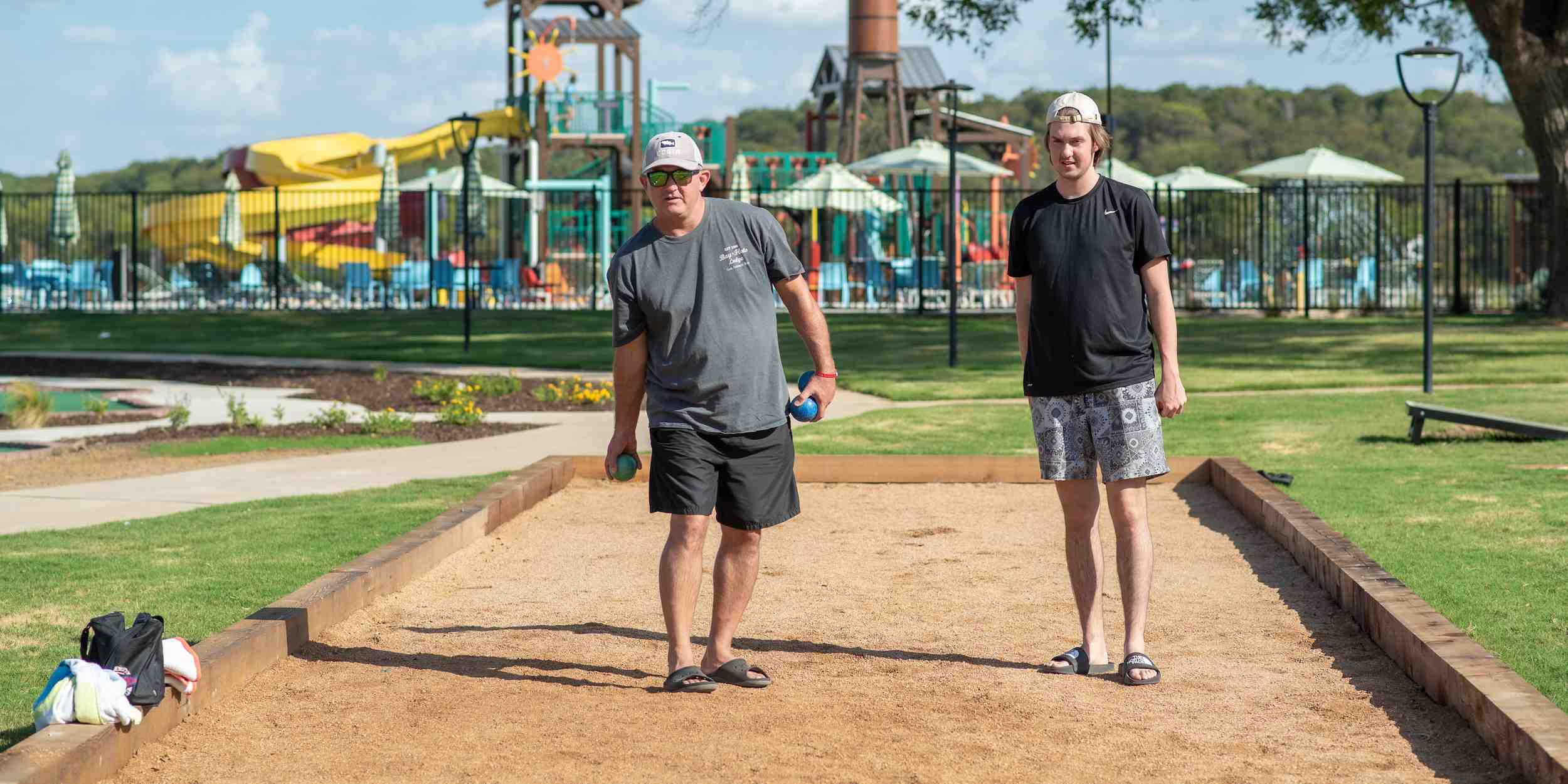 Guests playing bocce ball outside of Squirrely's Tavern in Waco, Texas