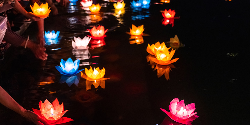 Water lanterns floating on water at the Water Lantern Festival in Fort Worth.