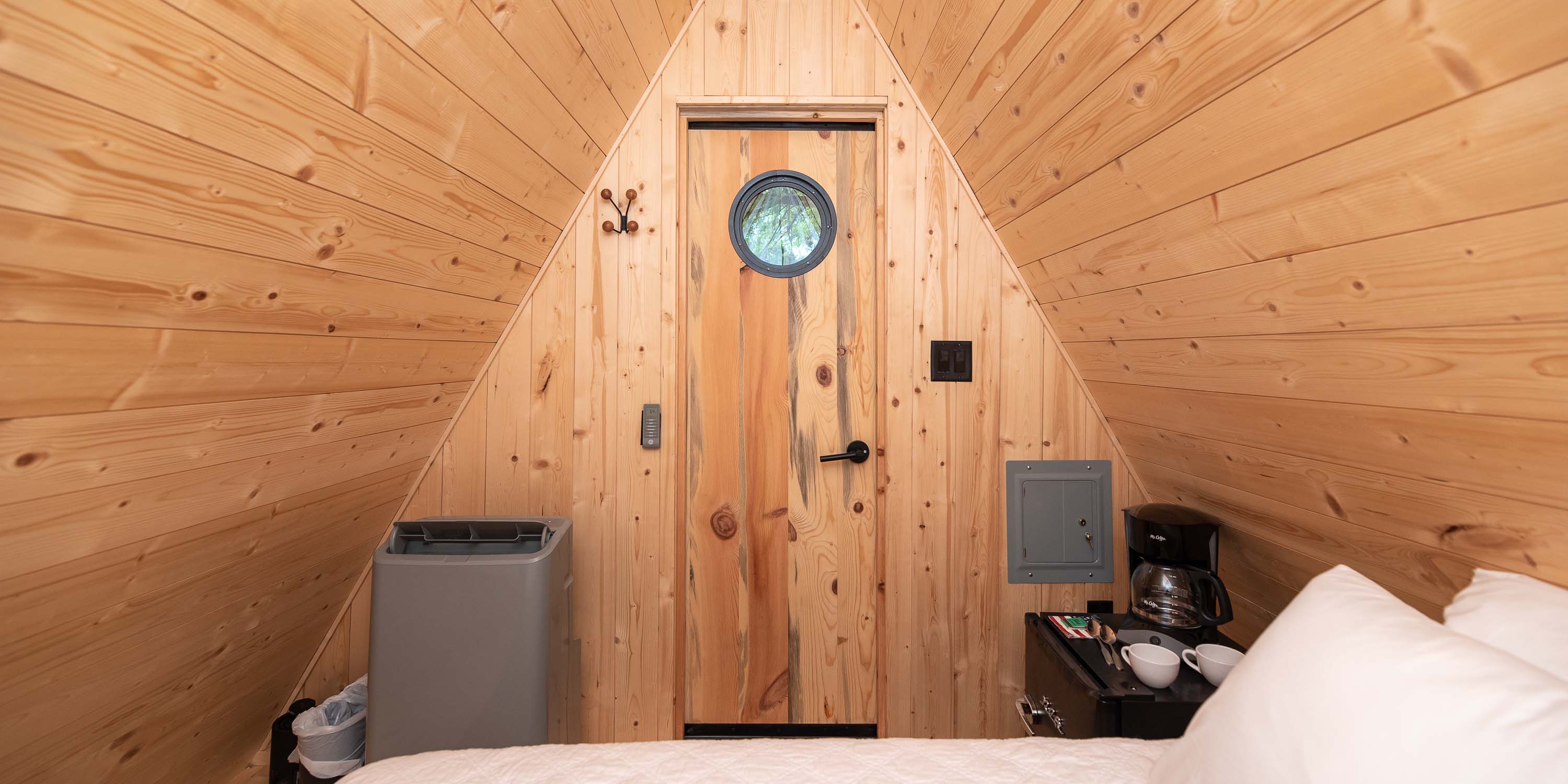 An inside view of a Riverview Cabin at Camp Fimfo Texas Hill Country, featuring some amenities