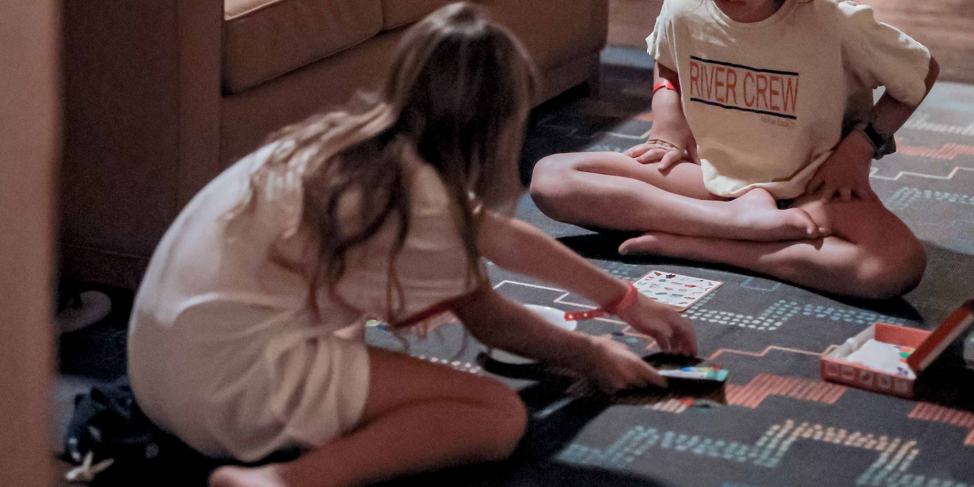 Guests playing games in a cabin at Camp Fimfo