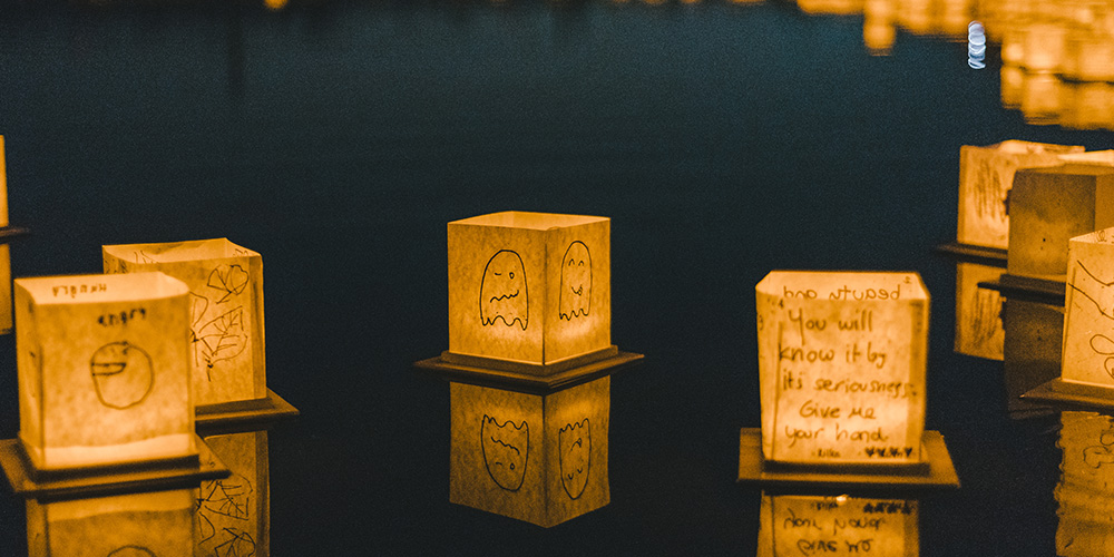 Lanterns floating during the Water Lantern Festival in Houston, TX.