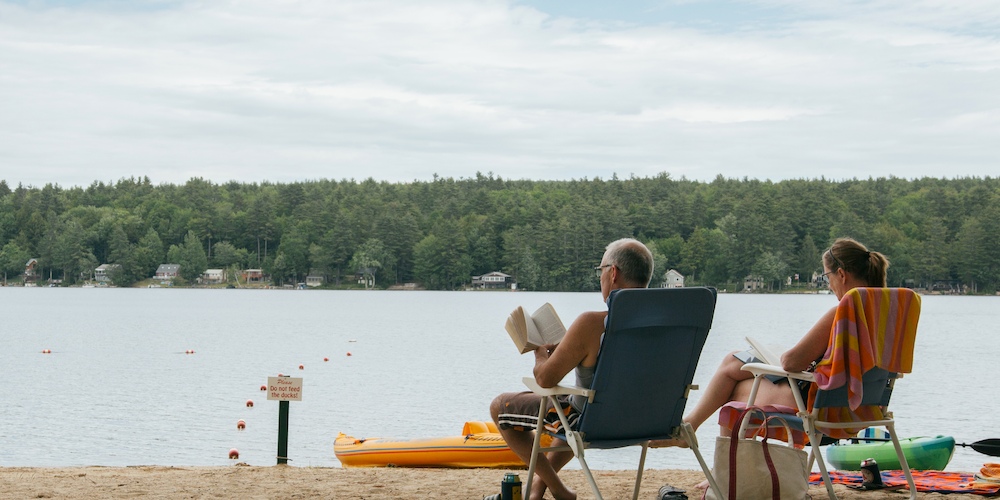 Relaxing by our lakefront is one of the benefits of camping at Jellystone Park™ Lakes Region!