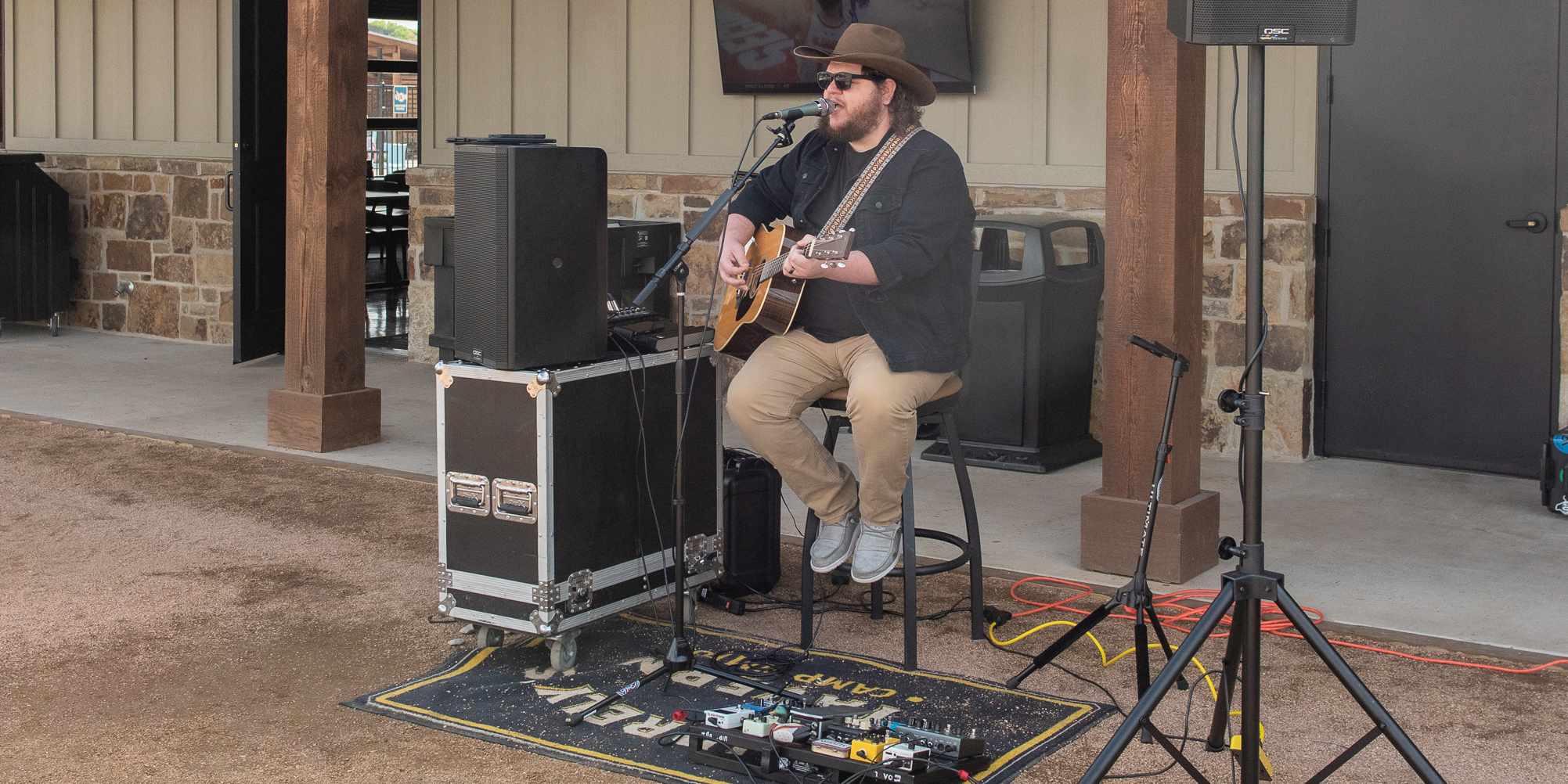 A live act performing outside at the patio of Squirrely's Tavern