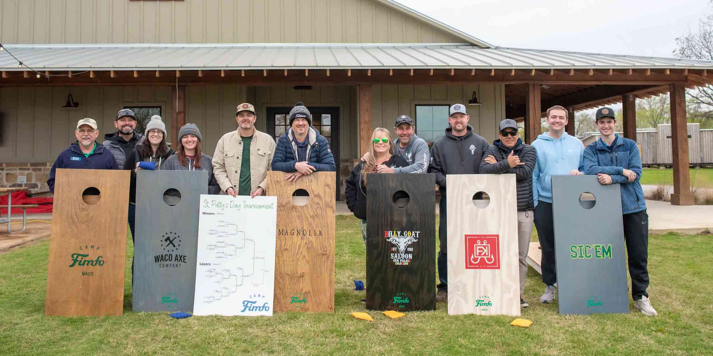 Teams lined up at the 2023 St. Patrick's Day Cornhole Tournament at Camp Fimfo Waco