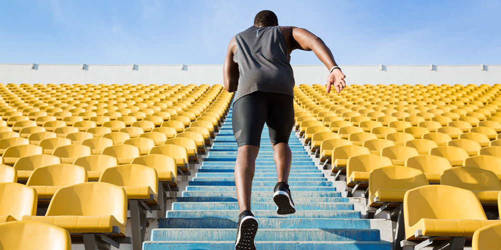 Man running up the stairs during the Fight for Air Climb event in Cleveland.