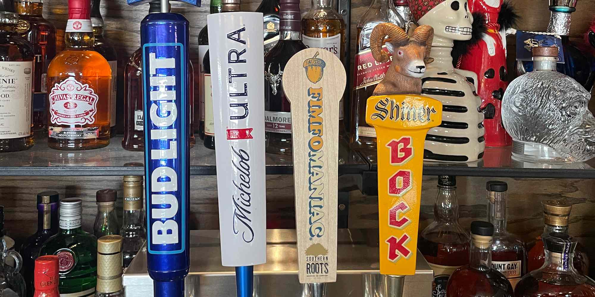 Draft beer tap handles at Squirrely's Tavern, including Fimfomaniac beer.