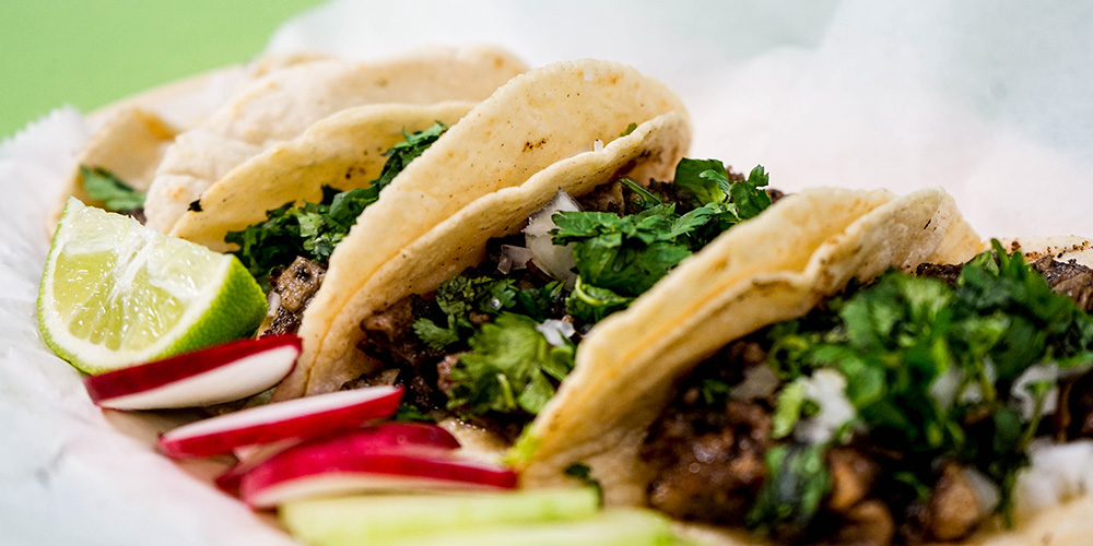 A row of tacos with cilantro at the Tacos & Tequila Festival in Richmond.