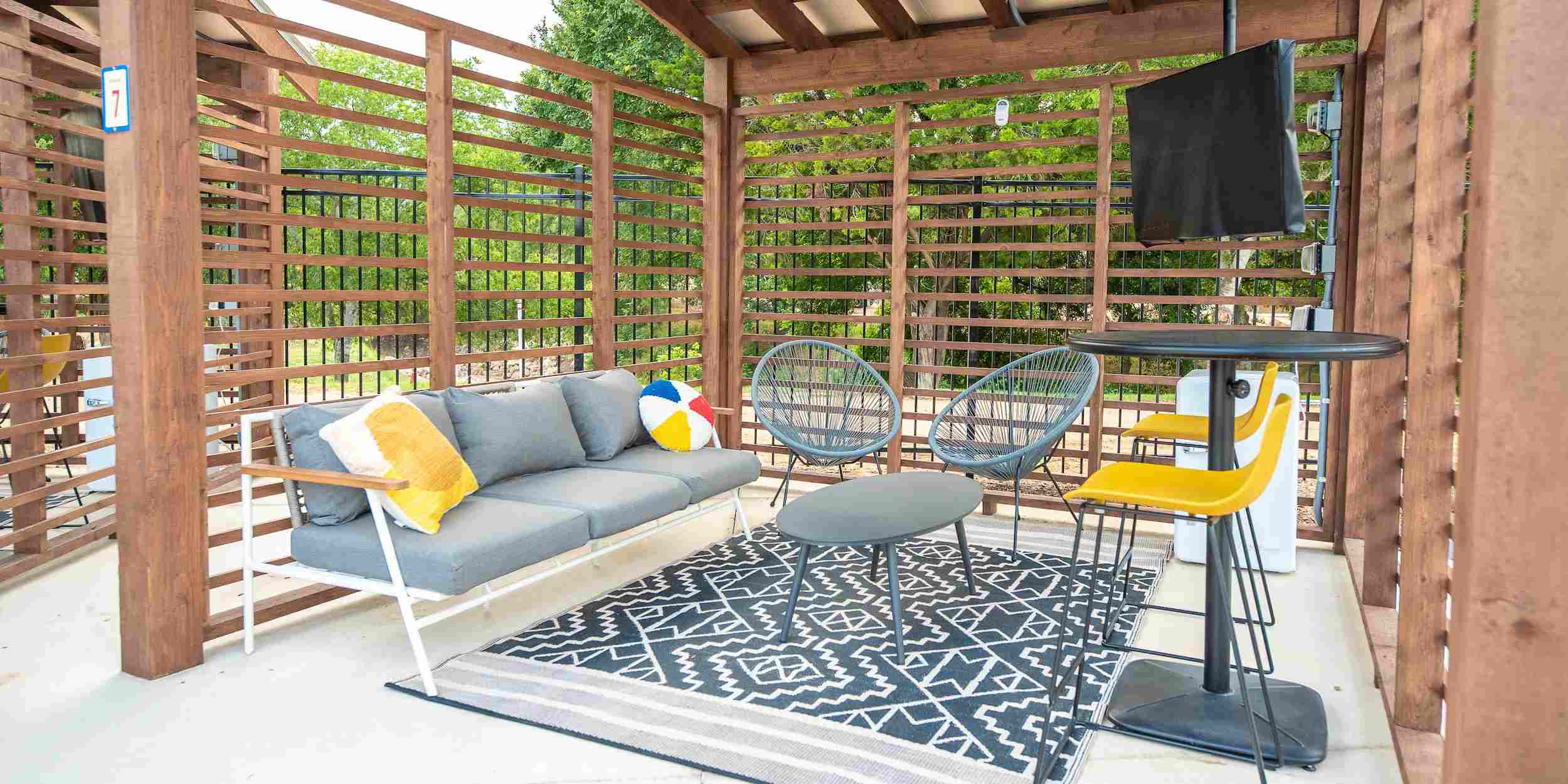 A poolside private cabana, available as an add-on at Camp Fimfo