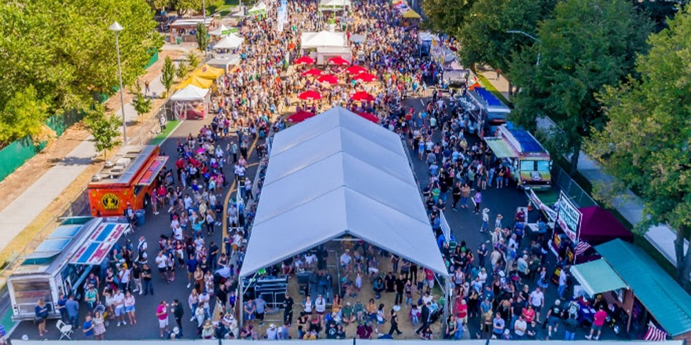 Crowd forming at Sacrament's Farm-to-Fork Festival that showcased delicious food and drinks.