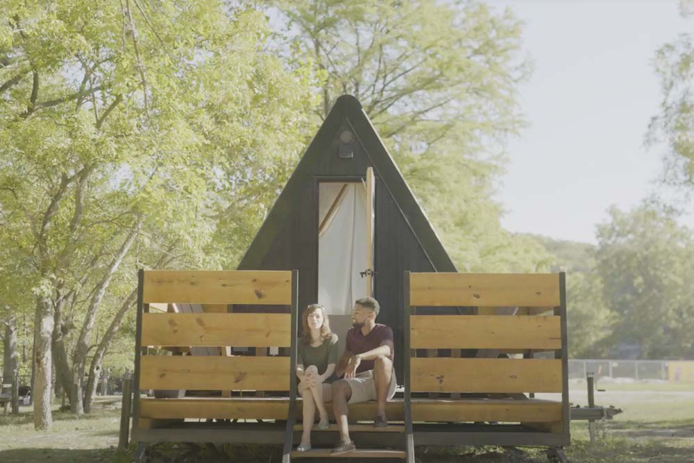 Couple sitting outside Riverview Cabins during romantic weekend getaway