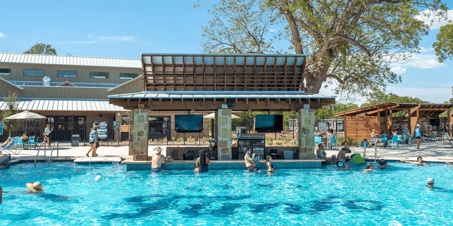 The pool and swim-up bar at Camp Fimfo Waco