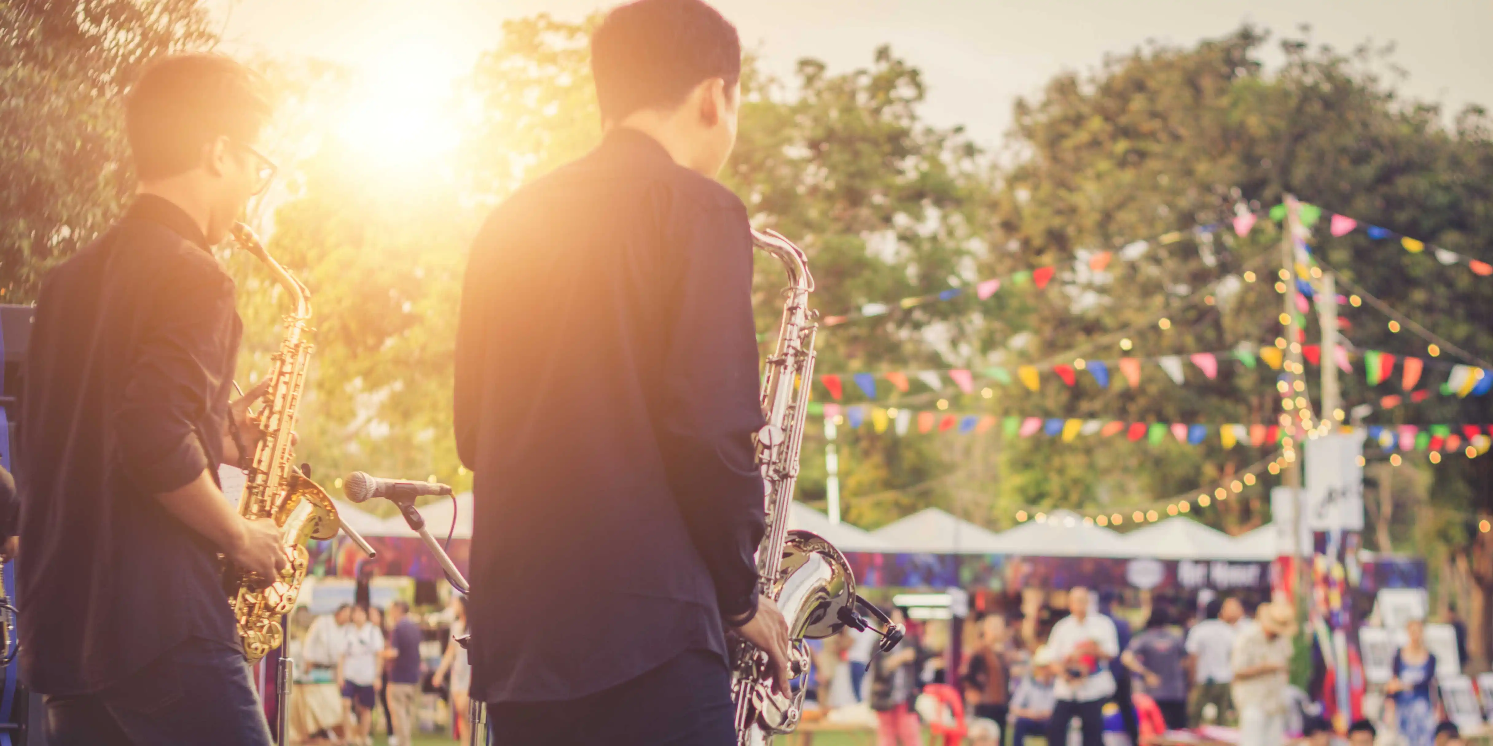 A jazz band performing at an outdoor art and music festival