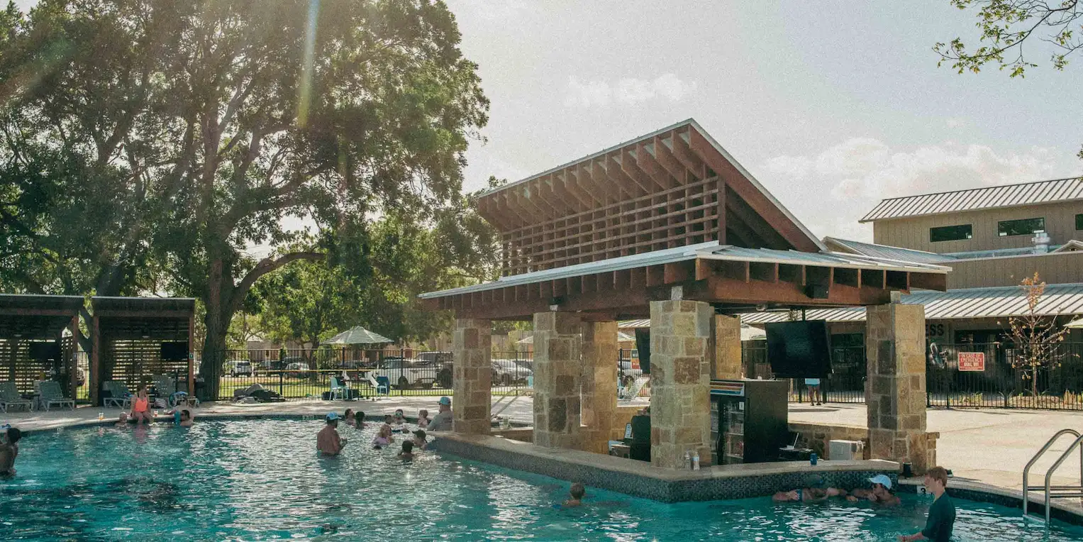 The No Dive Bar, a swim-up bar, at Camp Fimfo Waco