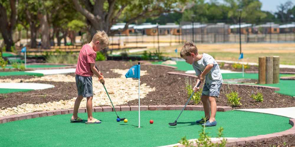 Children playing mini golf at Camp Fimfo