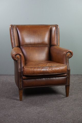 Stunning patinated sheepskin leather armchair