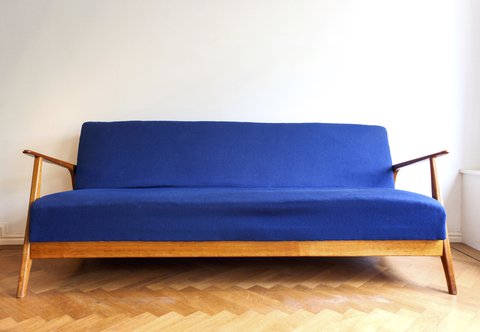 Danish Mid-Century cherry wood sofa bed from the late 1960s.