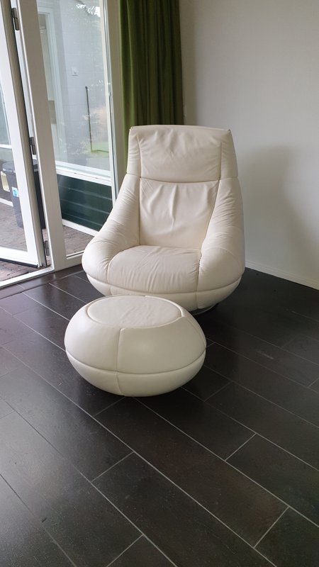 The Sede chair is white and polished
