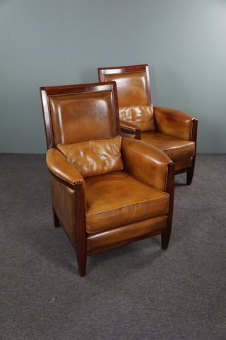 Set of two art deco style sheep leather armchairs