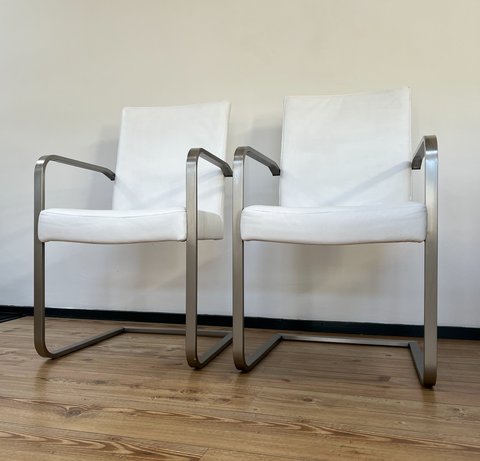 2x White leather design chairs