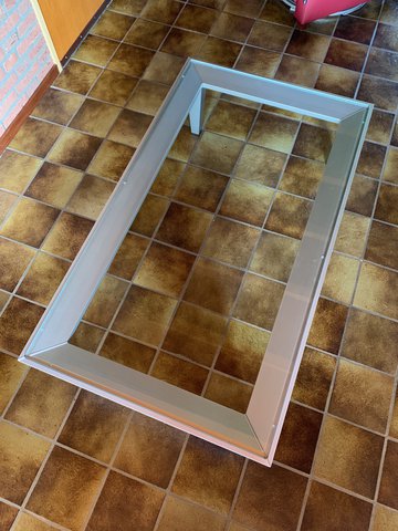 Leolux glass coffee table on aluminum frame