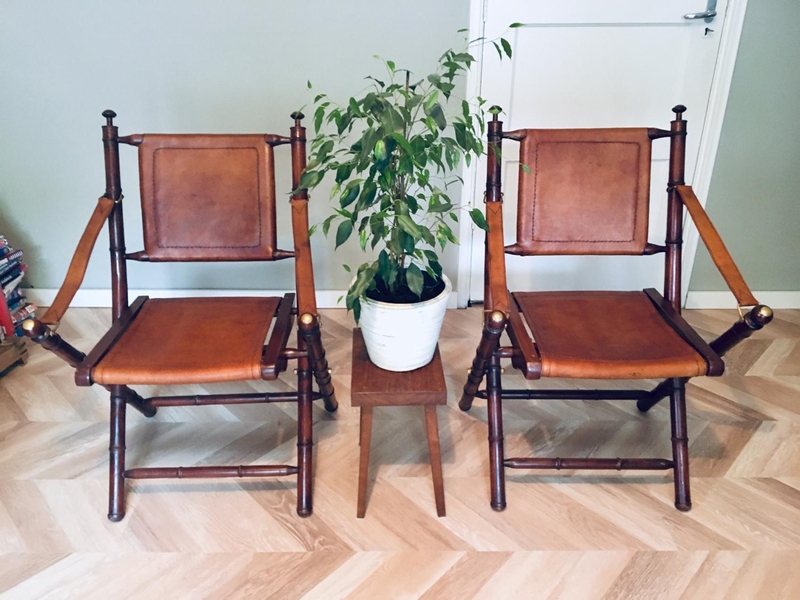 Two leather wooden chairs