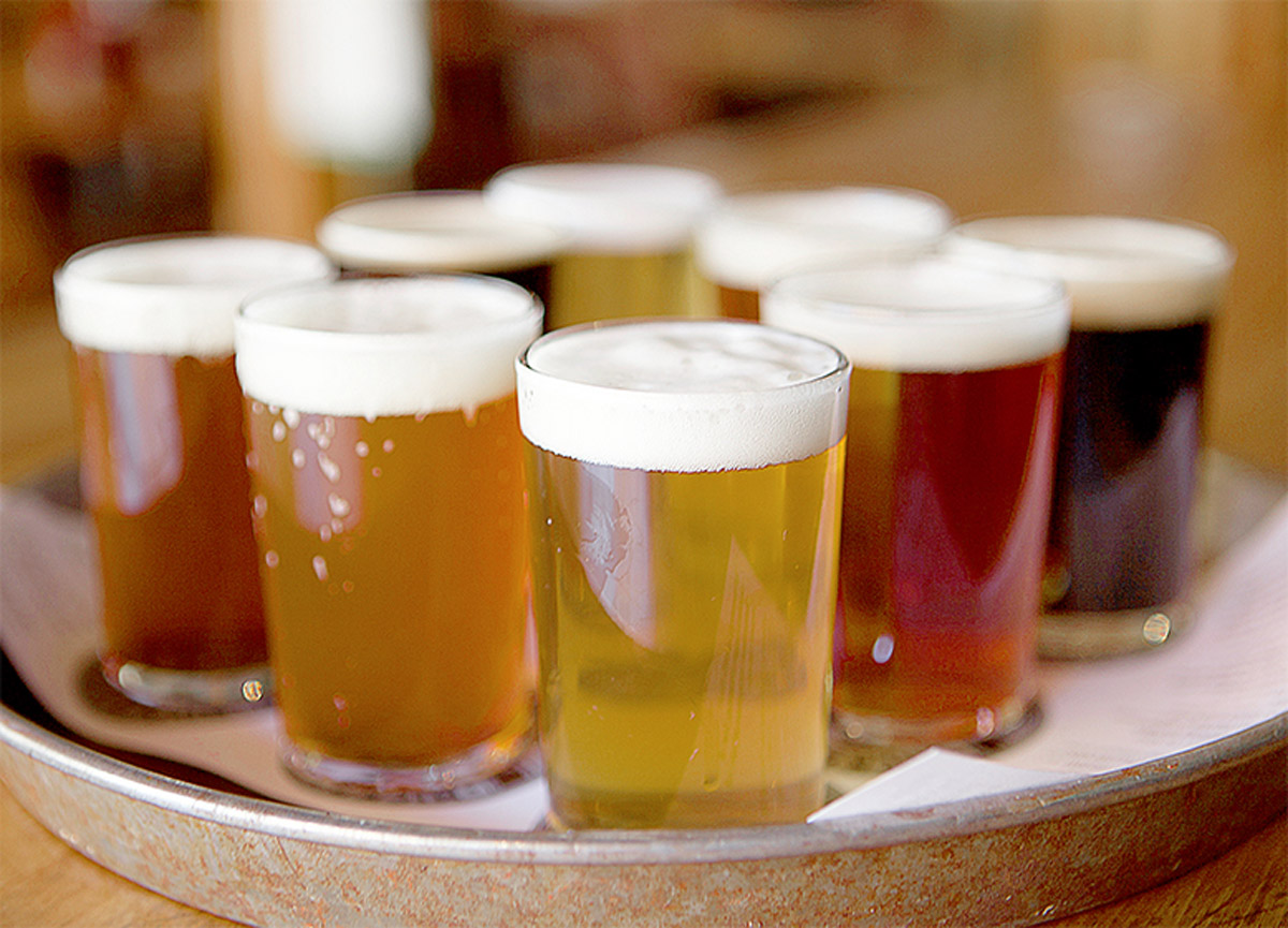 a tray of different beers