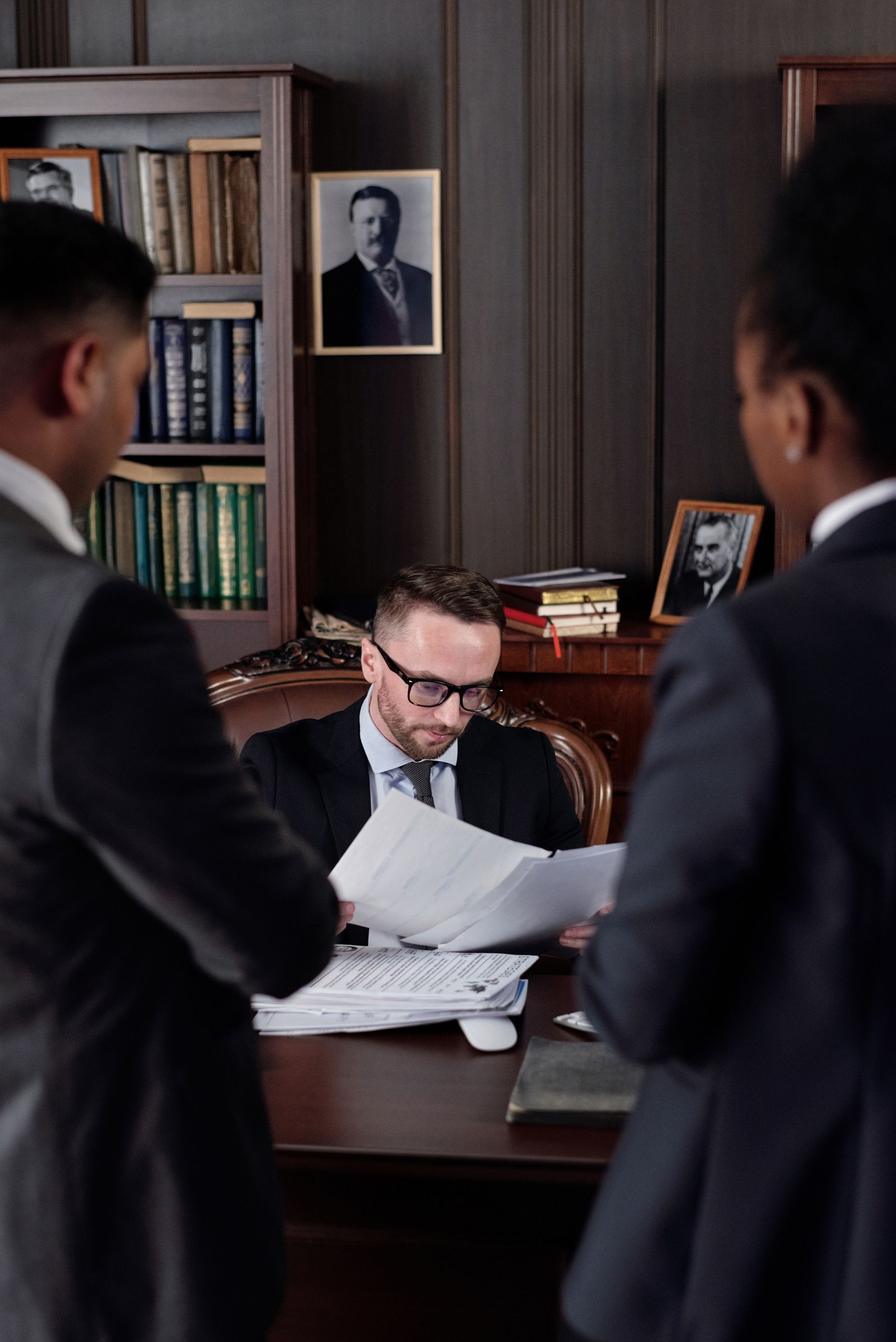 corporate legal team reviewing patent infringement lawsuit documents in Seoul law office