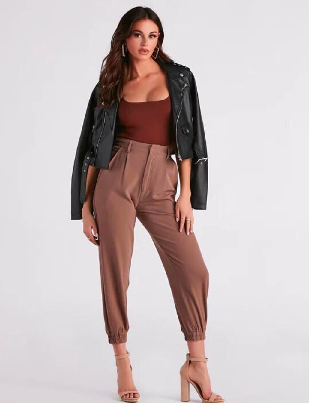 Paper bag pants outfit idea: leather jacket and bodysuit.