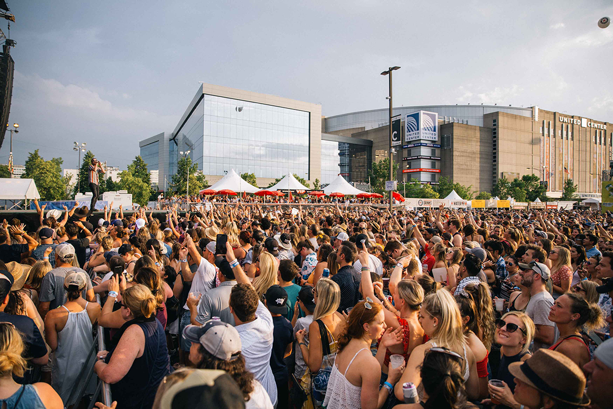 crowd of people watching a music performance