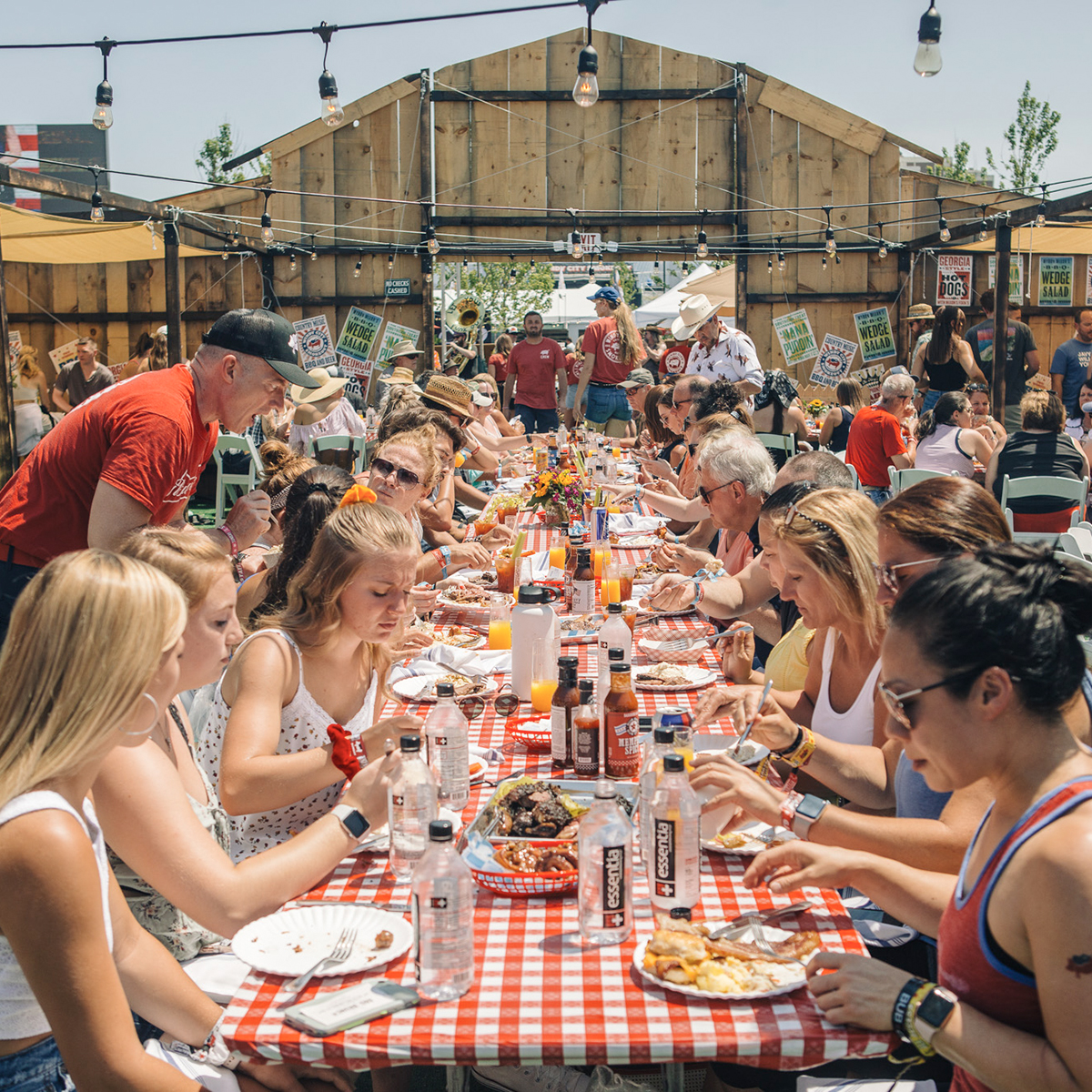 table of people sitting and eating a bbq brunch