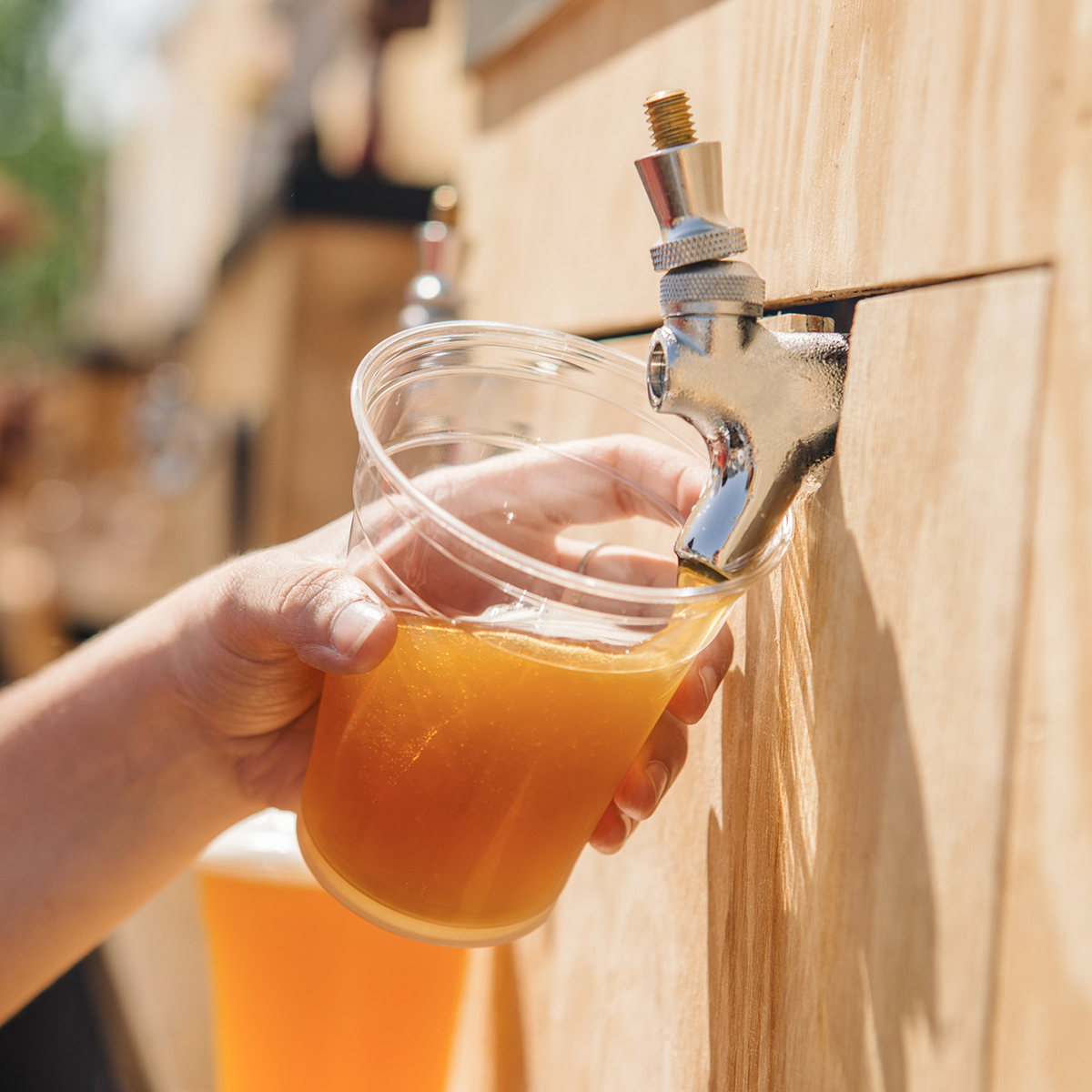 beer being poured from tap