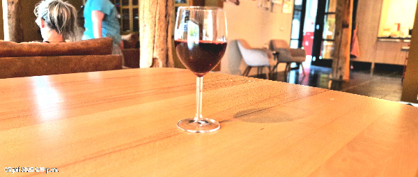 Unable to identify the specific wine due to the unclear image of the label. - Image 1