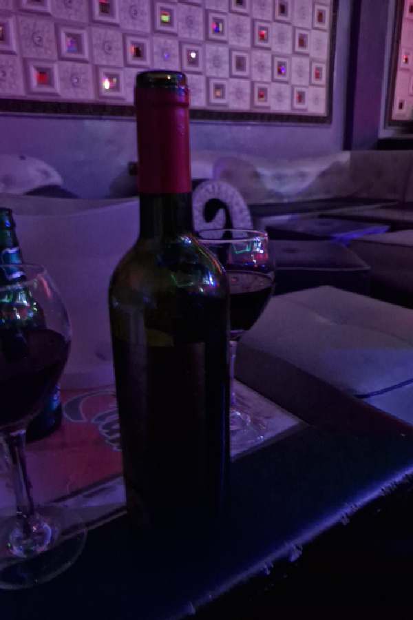 Unable to identify wine due to image clarity and label obstruction - Image 1