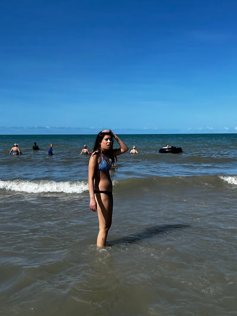 The girl standing in the shallows
