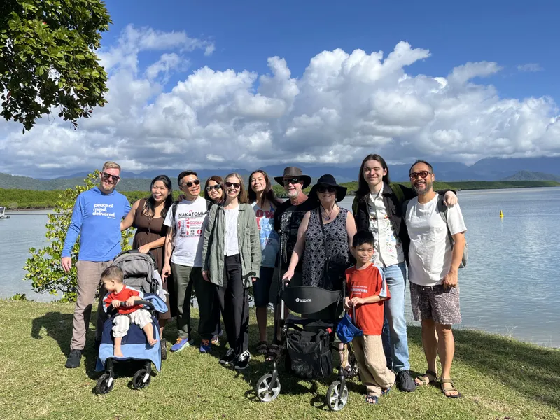 The whole group together on the grass by the inlet
