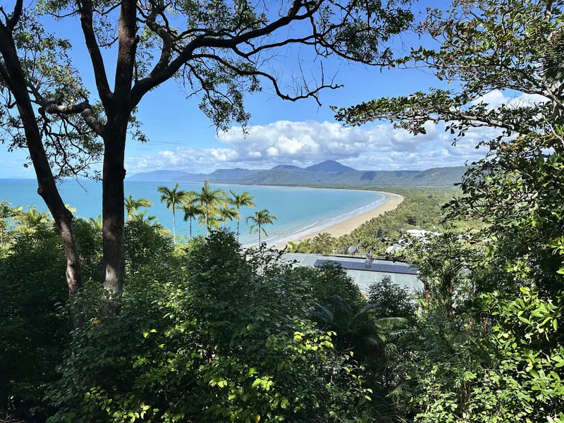 The long sweep of Four Mile Beach and the ranges through the trees